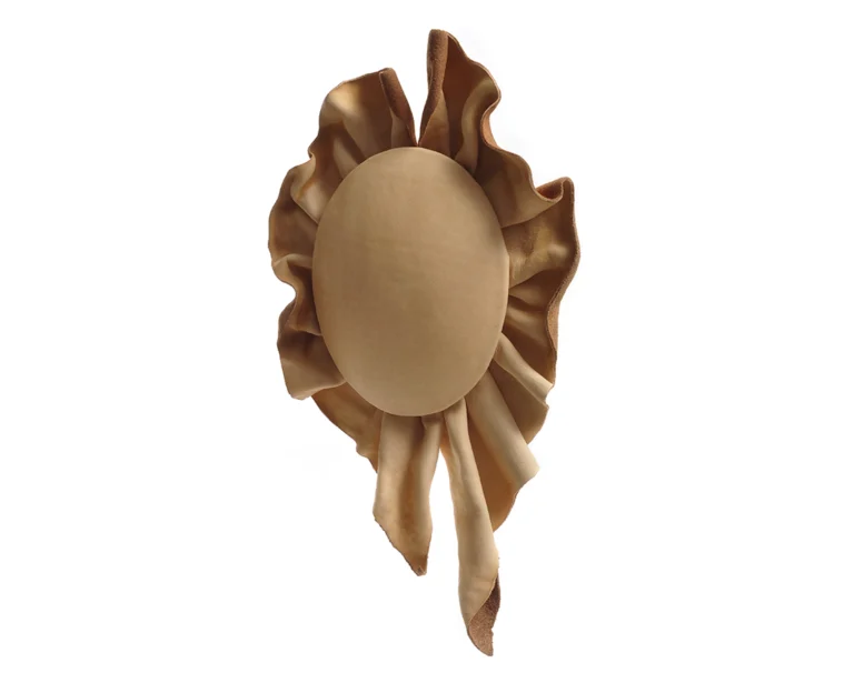 A art jewellery leather brooch on white background