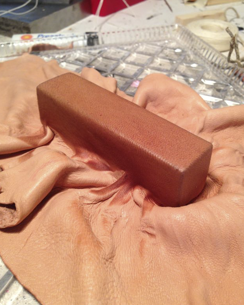 Close up of a piece of wet molded leather hardened with Cuir Bouilli